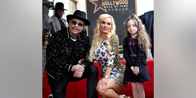 Ice-T poses with wife Coco Austin and daughter Chanel Marrow as he is honored with a star on the Hollywood Walk of Fame.