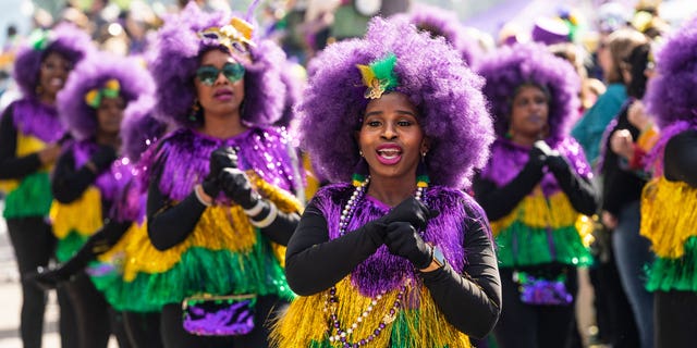 A marching troupe participates in the 2023 Krewe of Tucks parade on February 18, 2023 in New Orleans, Louisiana.