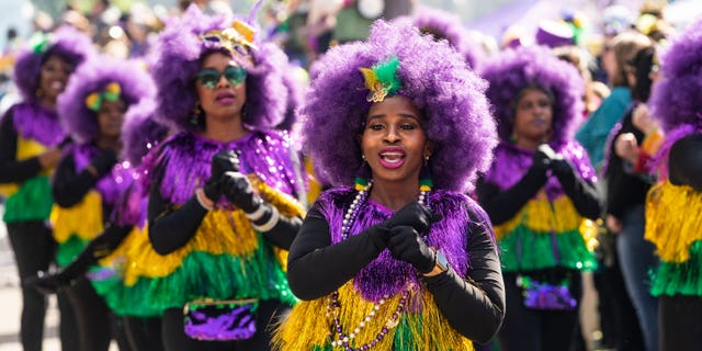 A marching troupe participates in the 2023 Krewe of Tucks parade on February 18, 2023 in New Orleans, Louisiana.