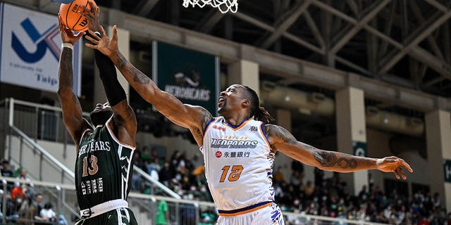 Center Dwight Howard of the Taoyuan Leopards fights for basket against the TaiwanBeer HeroBears on Feb. 19, 2023, in Taipei, Taiwan.