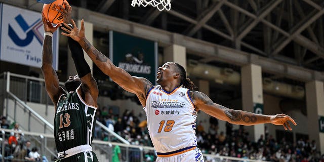Center Dwight Howard of the Taoyuan Leopards fights for basket against the TaiwanBeer HeroBears on Feb. 19, 2023, in Taipei, Taiwan.