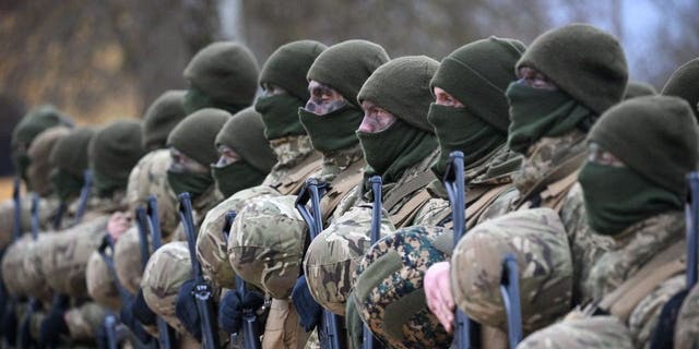Ukrainian soldiers during a service, on February 23, 2023, near Salisbury, England. Ahead of tomorrow's anniversary of the Russian Invasion of Ukraine, hundreds of soldiers from the armed forces of Ukraine and their UK instructors come together to remember those who have lost their lives in the war on Ukraine. 