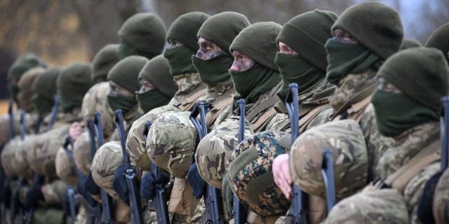 Ukrainian soldiers during a service, on February 23, 2023, near Salisbury, England. Ahead of tomorrow's anniversary of the Russian Invasion of Ukraine, hundreds of soldiers from the armed forces of Ukraine and their UK instructors come together to remember those who have lost their lives in the war on Ukraine. 