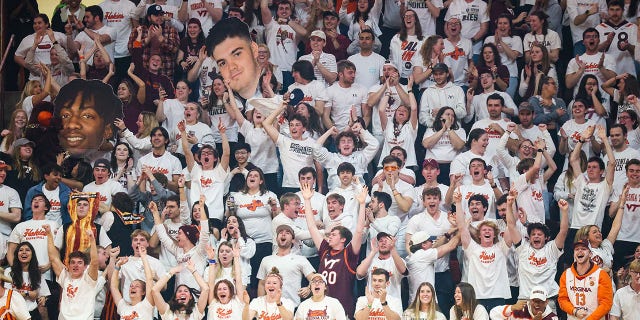 Virginia Tech Hokies fans cheer in the second half of the game against the Miami Hurricanes at Cassell Coliseum in Blacksburg, Virginia on Tuesday.