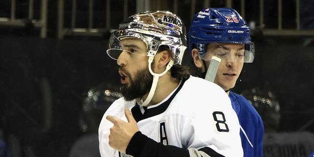 Drew Doughty, #8 of the Los Angeles Kings, argues with referee Eric Furlatt, #27, to call New York Rangers' K'Andre Miller, #79, during the first period at Madison Square Garden on Feb.  February 26, 2023 in New York City. 