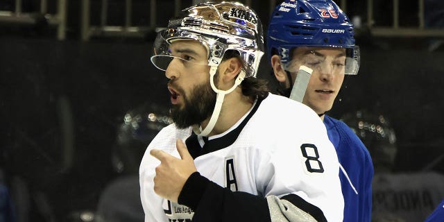Drew Doughty, #8 of the Los Angeles Kings, argues with referee Eric Furlatt, #27, for a penalty to be called on K'Andre Miller, #79 of the New York Rangers, during the first period at Madison Square Garden on Feb. 26, 2023 in New York City.