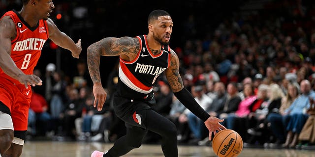 Damian Lillard, #0 of the Portland Trail Blazers, drives against the Houston Rockets in the first quarter at the Moda Center on February 26, 2023 in Portland, Oregon.