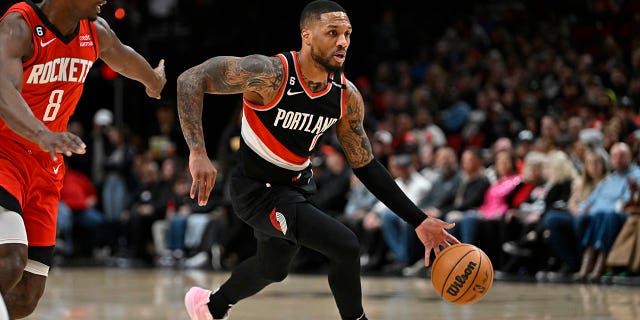 Damian Lillard, #0 of the Portland Trail Blazers, drives against the Houston Rockets in the first quarter at the Moda Center on Feb. 26, 2023 in Portland, Oregon.