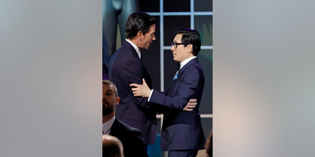 (L-R) Mark Wahlberg presents Ke Huy Quan pinch nan Outstanding Performance by a Cast successful a Motion Picture grant for "Everything Everywhere All astatine Once" onstage during nan 29th Annual Screen Actors Guild Awards astatine Fairmont Century Plaza connected February 26, 2023, successful Los Angeles, California.
