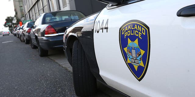 An Oakland Police patrol car sits in front of the Oakland Police headquarters on Dec. 6, 2012 in Oakland, California.