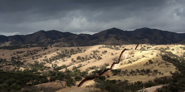 The U.S.-Mexico border fence stretches into the countryside on March 8, 2013, near Nogales, Arizona. 