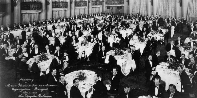 A look at the first organizational meeting of the Academy of Motion Picture Arts and Sciences in the Crystal Ballroom of the Los Angeles Biltmore Hotel. Mary Pickford, Douglas Fairbanks, Louis B. Mayer, Jack L. Warner and Darryl F. Zanuck attended the banquet and were early founders of the Academy