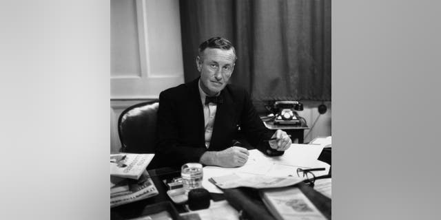 Ian Fleming, British writer and creator of James Bond, astatine his table successful his study. (Photo by Express/Express/Getty Images)