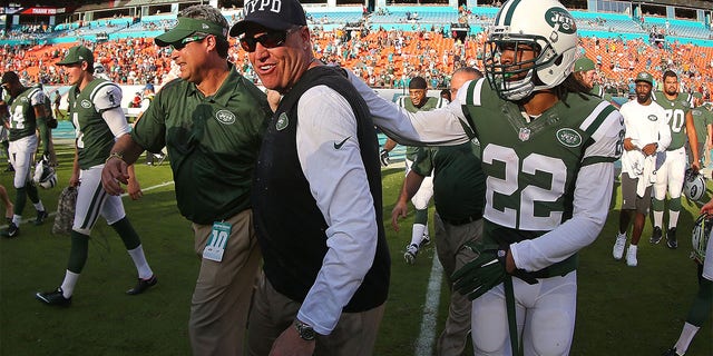 Head coach Rex Ryan of the New York Jets celebrates with players and coaches following a win against the Dolphins at Sun Life Stadium on Dec. 28, 2014, in Miami Gardens, Florida.