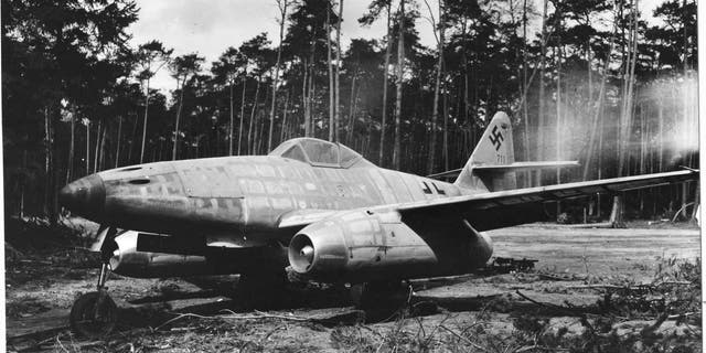 A German Messerschmitt 262A-1 jet-propelled fighter at the Rheinmain Airport, near Frankfurt, Germany, 1945. The Tuskegee Airmen shot down three ME-262s in their raid over Berlin in Mach 1945, despite its superior speed and dexterity. The first jet-propelled plane captured intact, it was flown over Allied lines and surrendered by its pilot who was supposed to be testing it at the time.