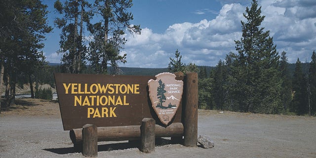 A sign at the south entrance to Yellowstone National Park, Wyoming, courtesy of the National Park Service, Department of the Interior, circa 1965. 