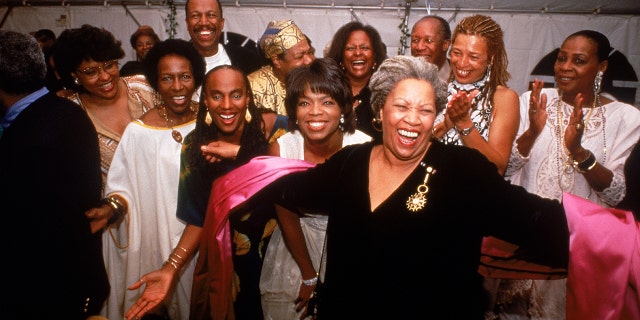 Nobel laureate Toni Morrison ((front, in black dress) acceps the applause of partygoers Susan Taylor, Rita Dove, Oprah Winfrey, Angela Davis, Maya Angelou and others in Winston-Salem, North Carolina.