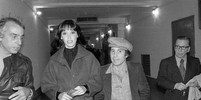 Actress Shelley Duvall and musician Paul Simon leave a theater after seeing Broadway hit "The Gin Game" in 1977.