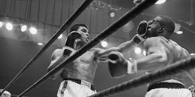 Boxer Cassius Clay punches boxer Sonny Liston successful nan sixth information during their conflict connected Feb. 25, 1964, successful Miami, Florida.