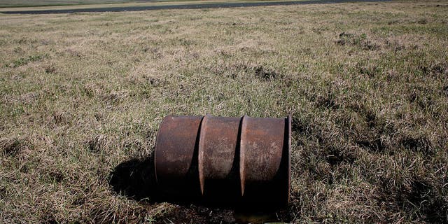 A lone oil barrel is pictured near the Kokalik River, which winds through the National Petroleum Reserve in northern Alaska. (Andrew Lichtenstein/Corbis via Getty Images)