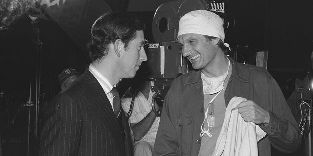 England's Prince Charles talks with American actor Alan Alda, who played Capt. Benjamin Franklin "Hawkeye" Pierce on "MASH" during a visit to the set of the show, Oct. 27, 1977. This "MASH" episode, entitled "Comrades In Arms (part 1)," aired on Dec. 6, 1977. 