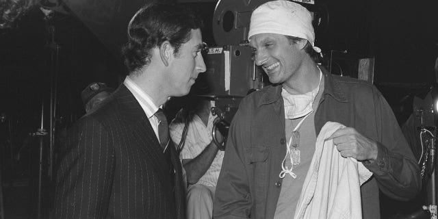 England's Prince Charles talks with American actor Alan Alda, who played Capt. Benjamin Franklin 