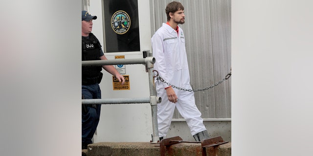 Nathan Carman arrives at the Coast Guard base in Boston Sept. 27, 2016, after surviving the sinking of his 32-foot fishing boat near Block Canyon, off New York, in the Atlantic Ocean.