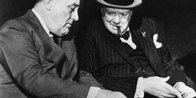 Franklin D. Roosevelt and Sir Winston Churchill discuss details of Germany's surrender in one of their last meetings at Casablanca. Both leaders agreed to seek the unconditional surrender of Germany.