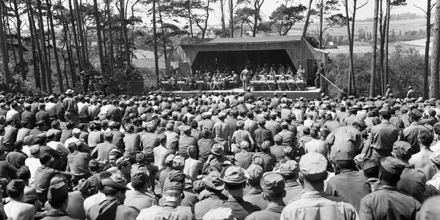 U.S. soldiers listen to a Saturday afternoon jam session by Glenn Miller's Band at Camp Herbert Tareyton near Le Havre, France. 