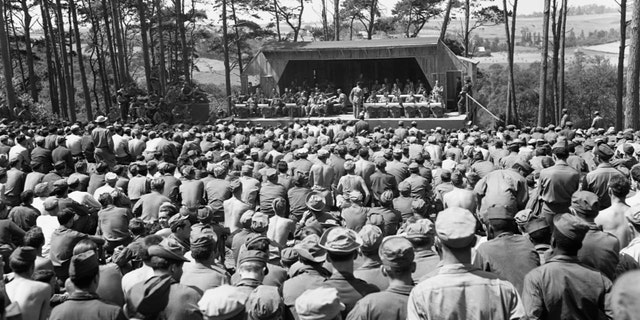 U.S. soldiers listen to a Saturday afternoon jam session by Glenn Miller's Band at Camp Herbert Tareyton near Le Havre, France.
