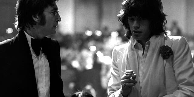 The two legendary rock bands maintained a friendly but sometimes intense rivalry over the years. Lennon is pictured with Jagger in 1974.