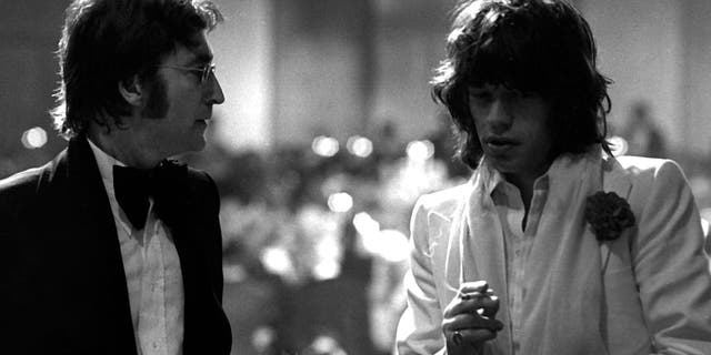 The two legendary rock bands maintained a friendly but sometimes intense rivalry over the years. Lennon is pictured with Jagger in 1974.