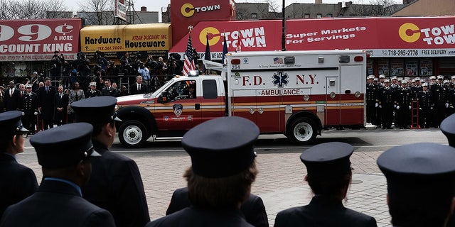 New York City Fire Department EMT workers attend the funeral of colleague Yadira Arroyo in the Bronx on March 25, 2017, in New York City.