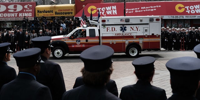 New York City Fire Department EMT workers attend the funeral of colleague Yadira Arroyo in the Bronx on March 25, 2017, in New York City.