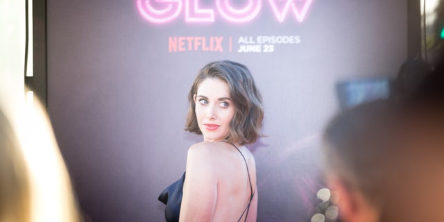 "GLOW" star Alison Brie has admitted she doesn't mind stripping down for a role.