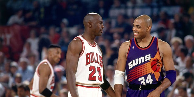 Charles Barkley (34) of the Phoenix Suns talks with Michael Jordan (23) of the Chicago Bulls during Game 5 of the 1993 NBA Finals at Chicago Stadium on June 18, 1993 in Chicago.