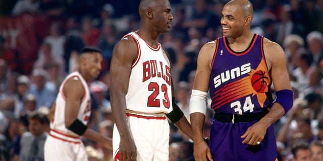 Charles Barkely (34) of the Phoenix Suns chats with Michael Jordan (23) of the Chicago Bulls in Game 5 of the 1993 NBA Finals June 18, 1993, at Chicago Stadium in Chicago.