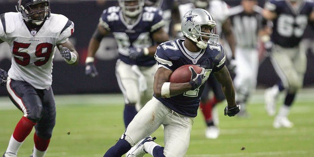 Sam Hurd of the Dallas Cowboys carries the ball during a game against the Houston Texans at Reliant Stadium in Houston, Texas, on Aug. 25, 2007.