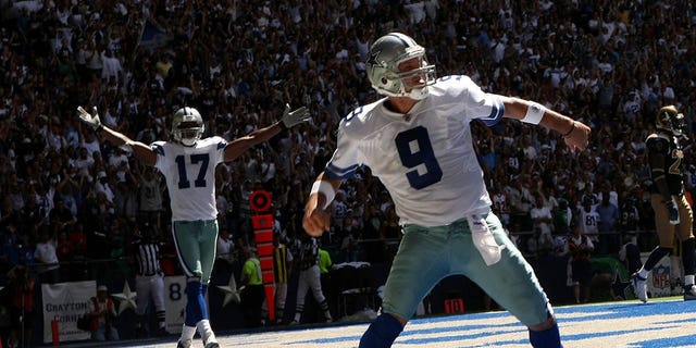Quarterback Tony Romo, right, and wide receiver Sam Hurd of the Dallas Cowboys celebrate after Romo's 15-yard touchdown run against the St. Louis Rams at Texas Stadium  in Irving, Texas, on Sept. 30, 2007.