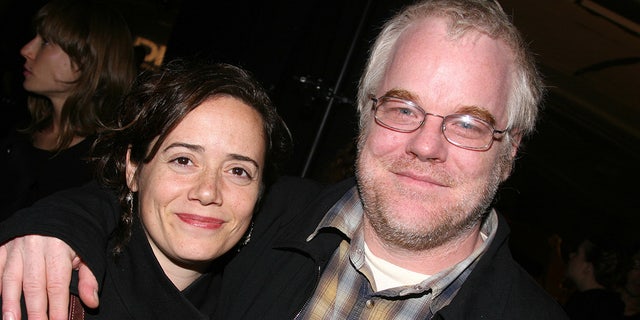 Hoffman died in 2014. He is pictured here with his wife of 14 years. They shared three children together. 