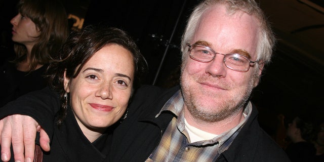 Hoffman died in 2014. He is pictured here with his wife of 14 years. They shared three children together. 