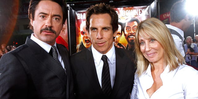 (L-R) Actors Robert Downey Jr., Ben Stiller and CEO of Dreamworks Stacey Snider arrive on the red carpet of the Los Angeles Premiere Of "Tropic Thunder" at the Mann's Village Theater on August 11, 2008 in Los Angeles, California.