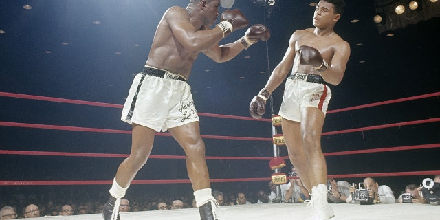 Cassius Clay, right, successful action vs. Sonny Liston successful nan World Heavyweight Title conflict connected Feb. 25, 1964, astatine Convention Hall successful Miami, Florida.