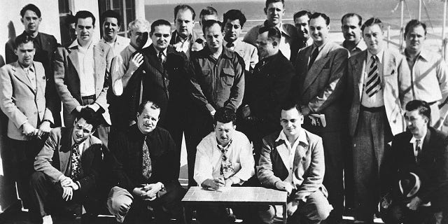 A series of three meetings convened at the Streamline Hotel in Daytona Beach to establish criteria for professional stock car racing, leading to NASCAR's formation. On Dec. 14, 1947: Front row, kneeling (L-R), Chick DiNatale, Jimmy Quisenberry, Ed Bruce, Jack Peters, Alvin Hawkins. Back row, standing (L-R), Freddie Horton, Sam Packard, Ed Samples (hidden), Joe Ross, Marshall Teague, Bill Tuthill, Joe Littlejohn, Bob Osiecki, Buddy Shuman, Lucky Sauer (hidden), Tom Galan, Eddie Bland, Bill France Sr., Bob Richards, Harvey Tattersall Jr., Fred Dagavar, Bill Streeter, Jimmy Cox. 