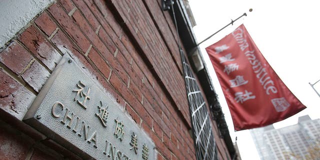 A plaque and flag hang outside the China Institute, headquarters of the Confucius Institute, in New York.