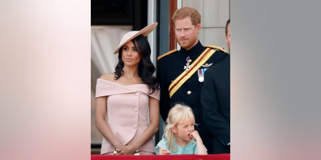 Meghan, Duchess of Sussex, Prince Harry, Duke of Sussex on the balcony of Buckingham Palace during Trooping The Colour 2018.