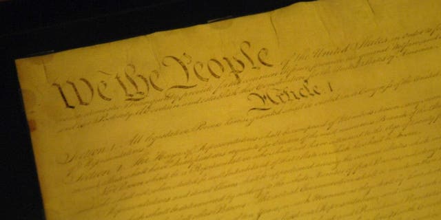 The Constitution of the United States is stored under glass in the rotunda of the National Archives.