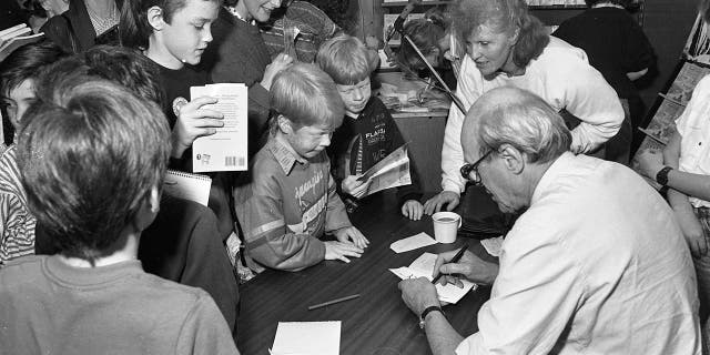 Roald Dahl autographs books in Dun Laoghaire shopping centre on October 22, 1988.