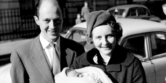 Colin Tennant and Lady Anne Glenconner outside the London nursing home with their first baby Charles.