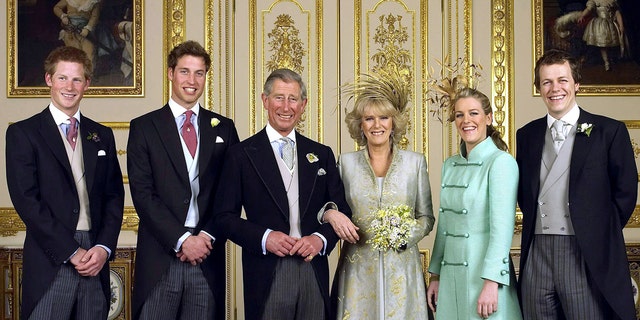 The Prince of Wales and his bride Camilla, Duchess of Cornwall, are flanked by their children Prince Harry, Prince William, Laura Parker Bowles and Tom Parker Bowles in the White Drawing Room at Windsor Castle. The couple tied the knot on April 9, 2005.
